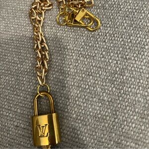Gold Louis Vuitton Cadenas - lock and key